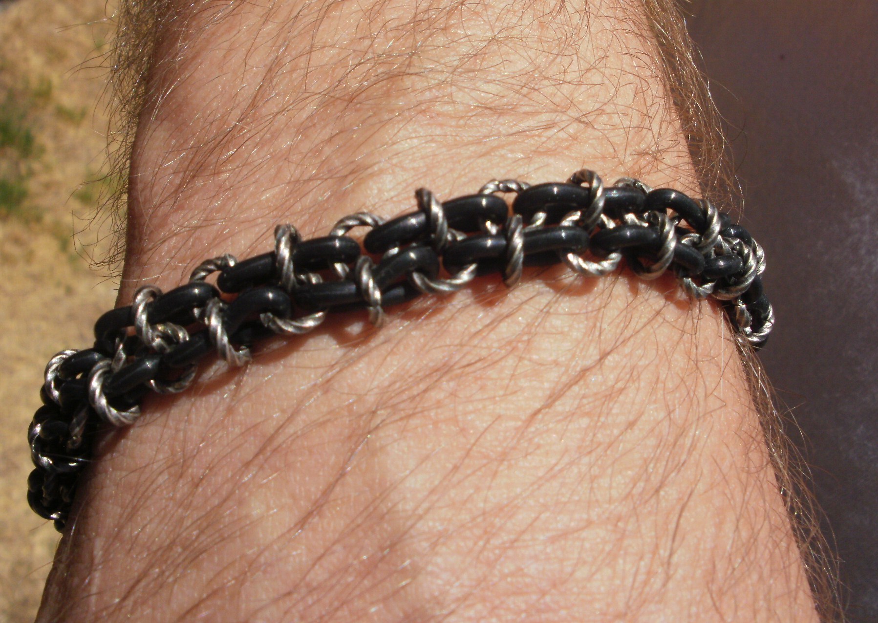 Double row black rubber and metal ring bracelet, available on my Artfire site, link on this page. 