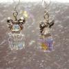 Swarovski crystal elements Clear AB cubes in two sizes divided by a crystal spacer and layered underneath a cute little silver bows, they make great Christmas earrings but are adorable any time.  18.00